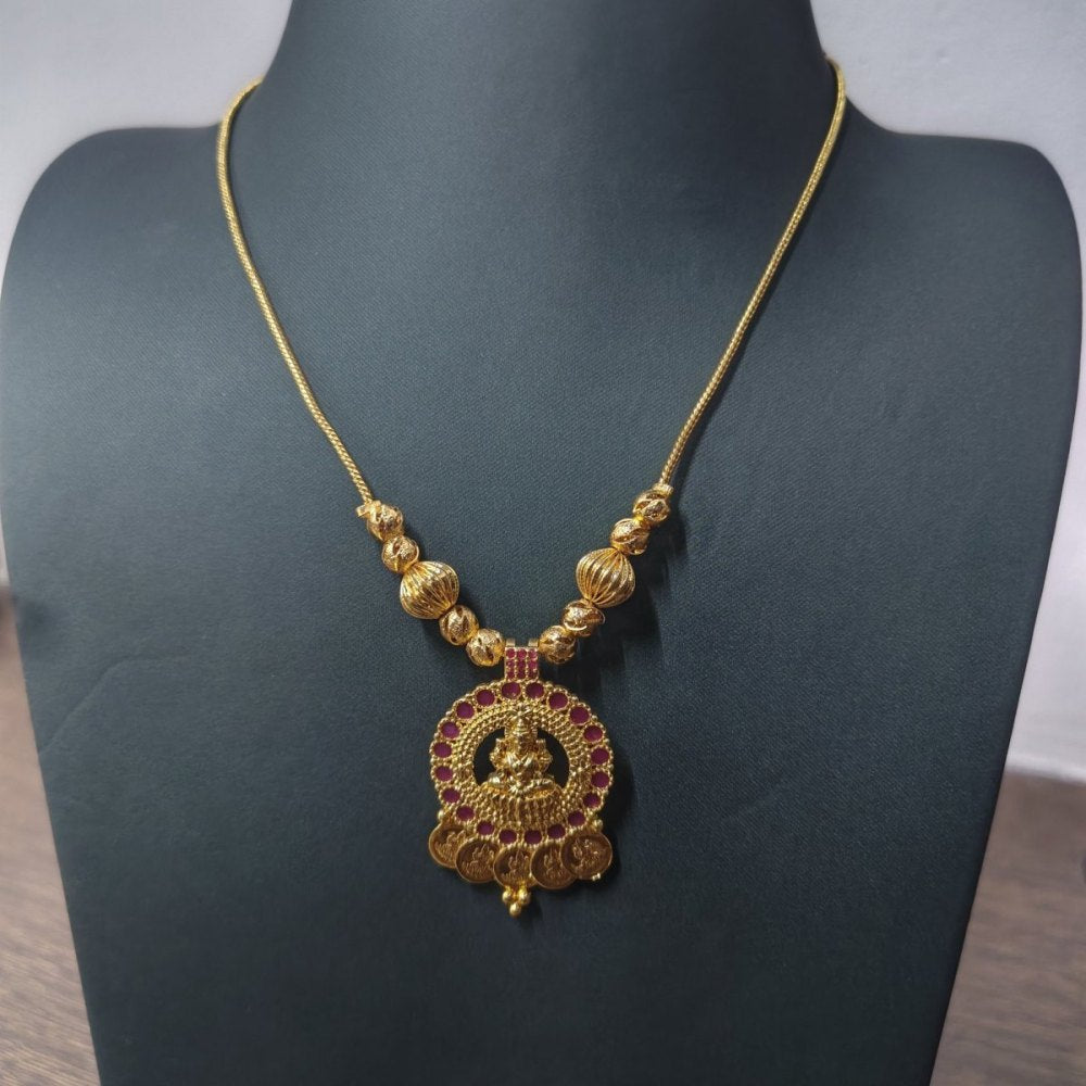 Lakshmi temple pendant chain with coins on a necklace stand